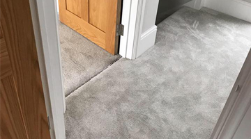 A grey fitted carpet by K A Flooring Hertford
