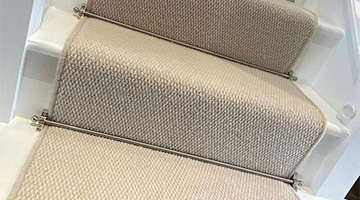 Beige Stair Carpet with stair rods in Hertford